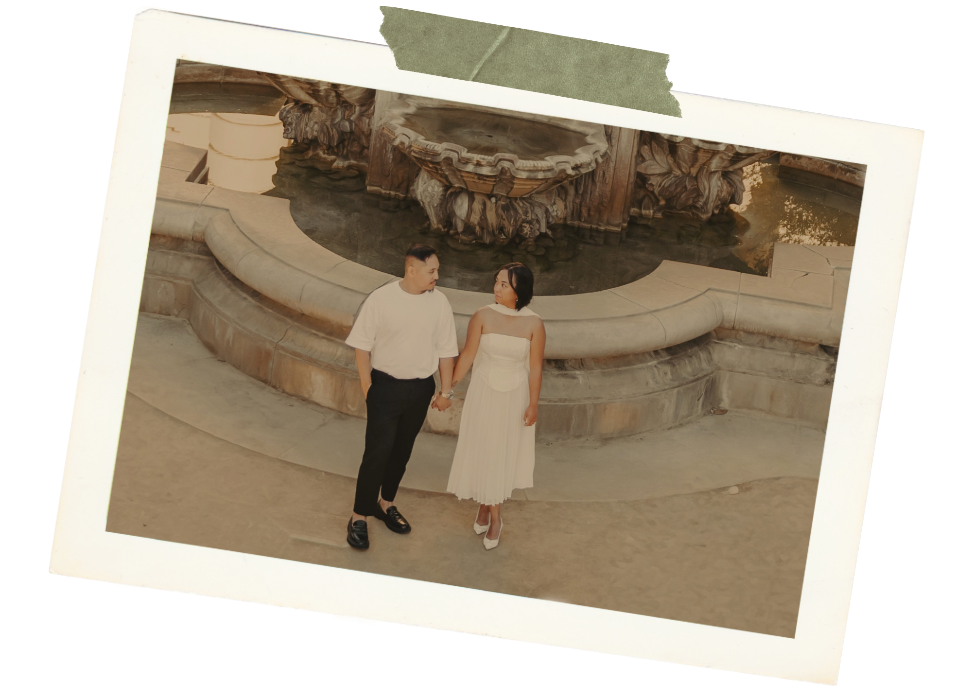 Jyselle and Kyle holding hands by a fountain